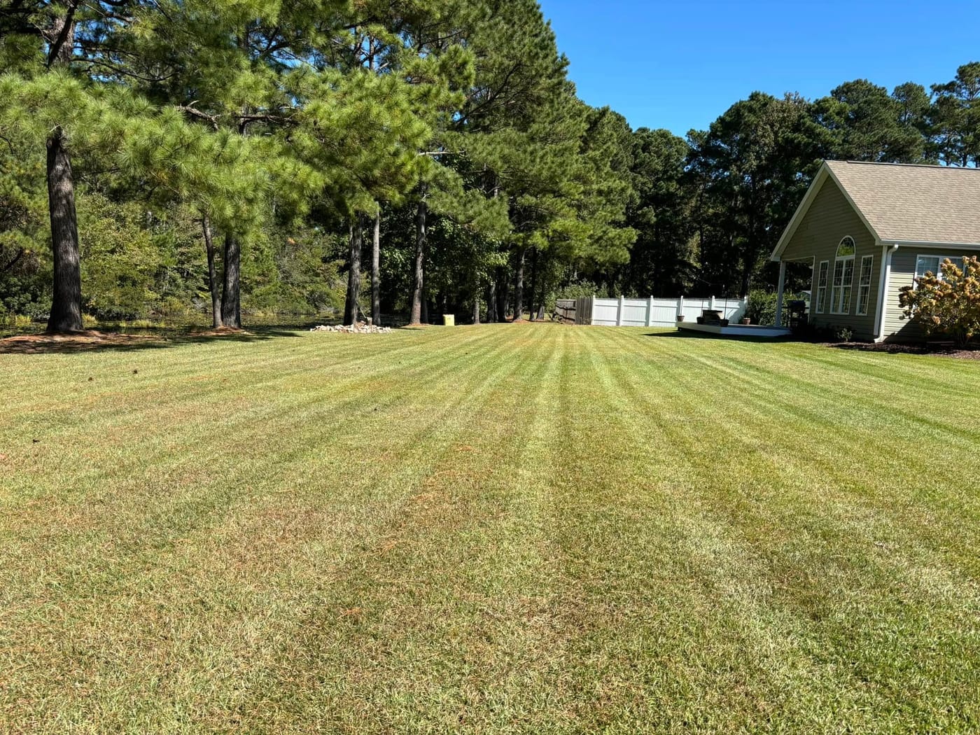 Landscaped front yard with fresh mulch and green grass
