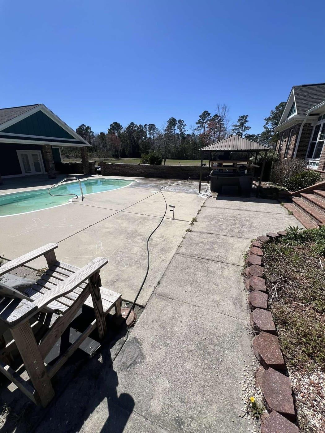 Cleaned siding and brick by On Edge Lawn Care