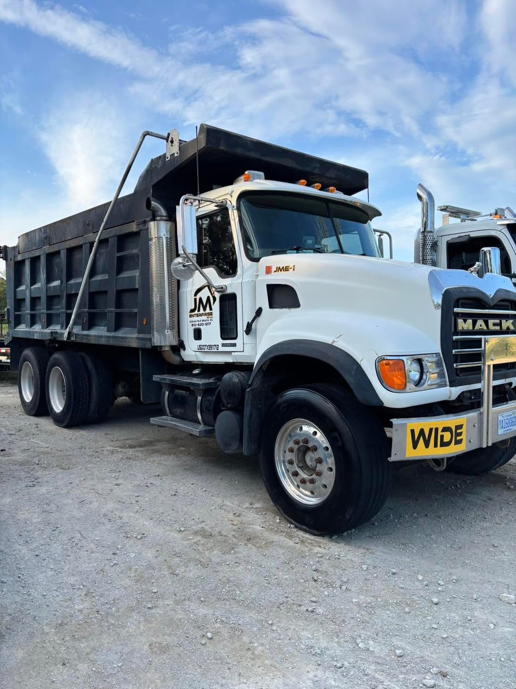On Edge Lawn Care dump truck loaded on site