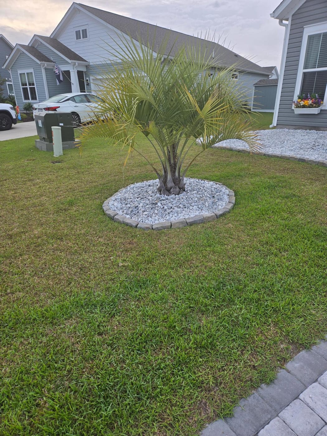 Fresh mulch and landscaped beds by On Edge Lawn Care