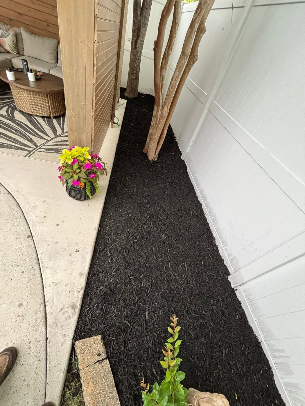 Landscaped front yard with fresh mulch and green grass