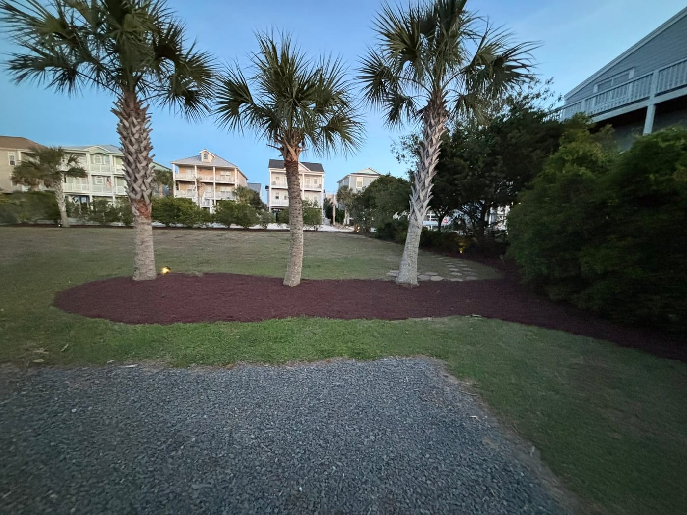 Fresh mulch and landscaped beds by On Edge Lawn Care