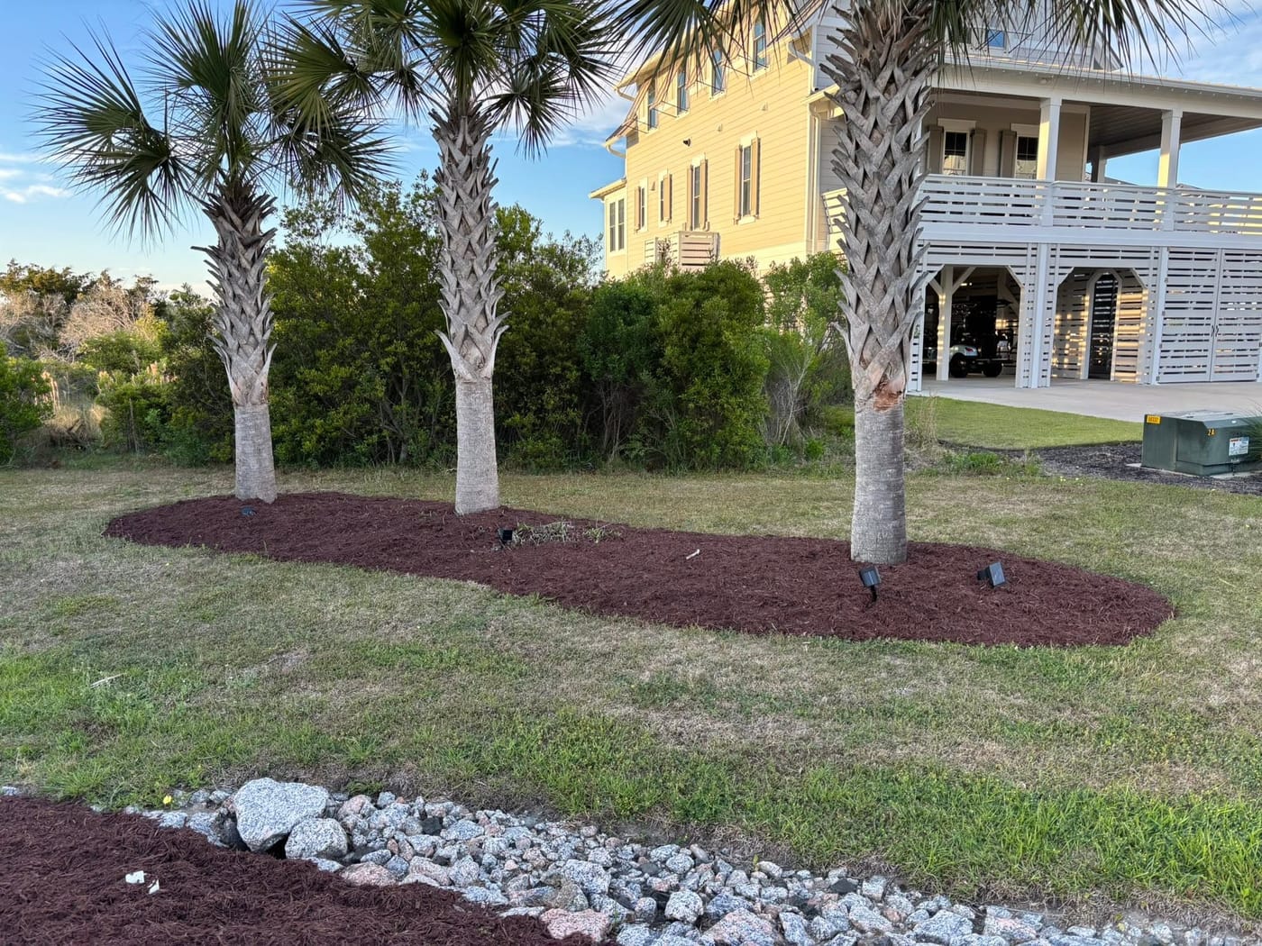 Manicured lawn and trimmed shrubs at a Brunswick County home