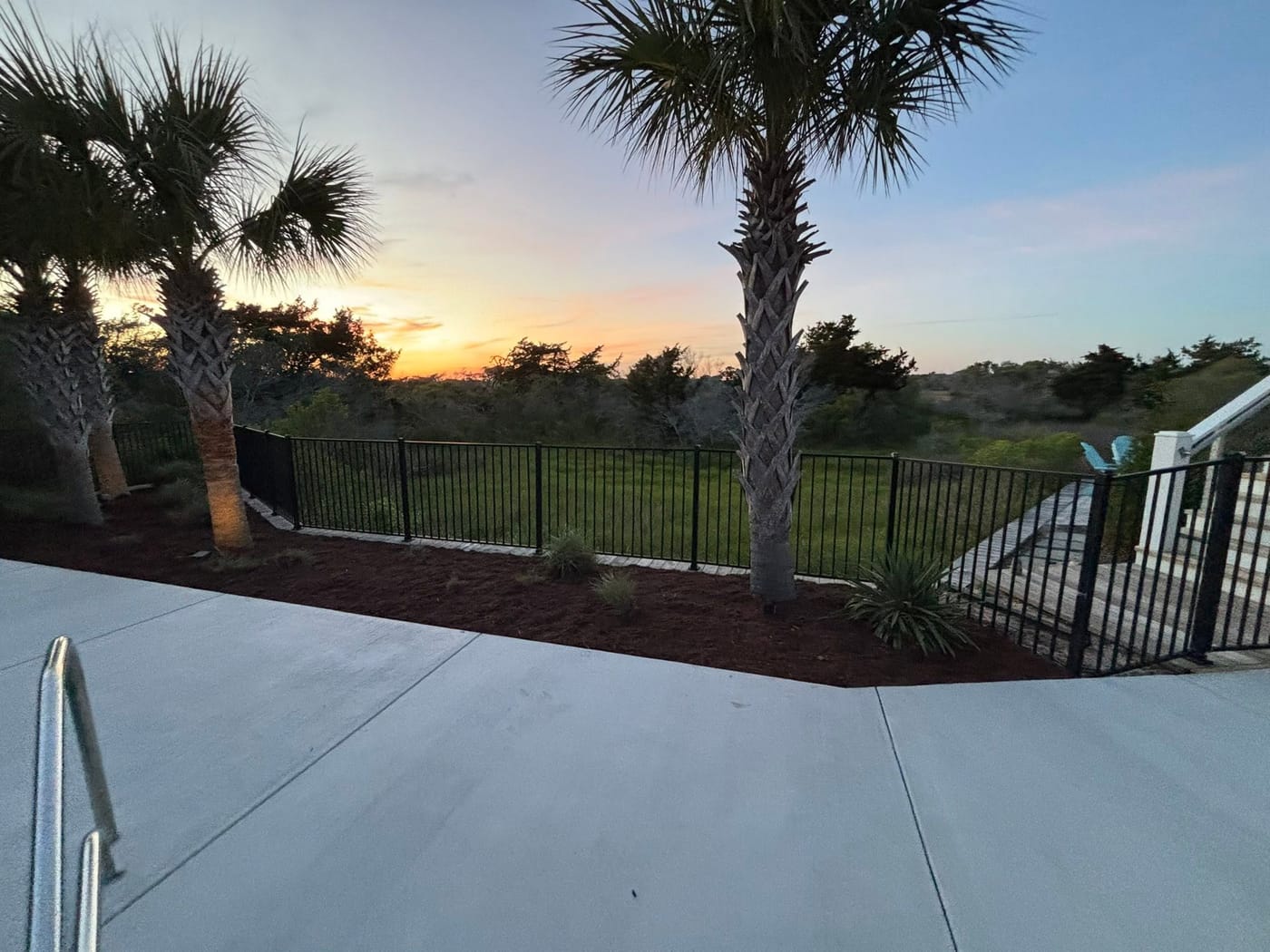 Landscaped front yard with fresh mulch and green grass