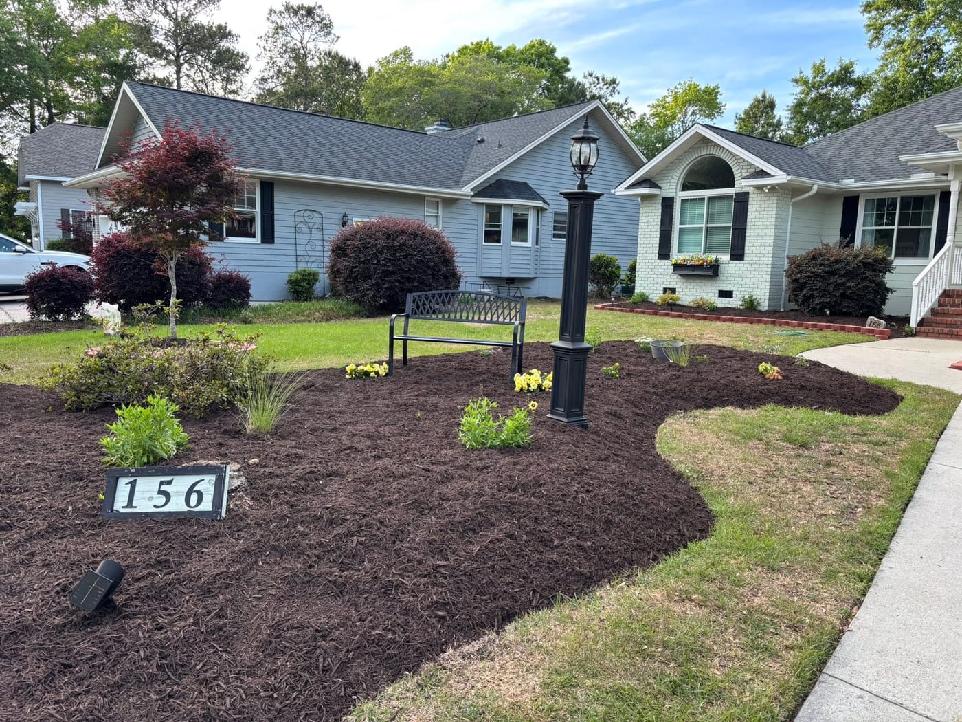 Manicured lawn and trimmed shrubs at a Brunswick County home