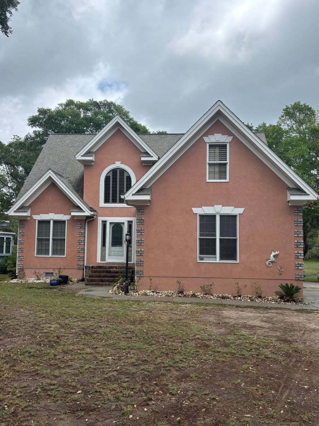 Landscaped front yard with fresh mulch and green grass