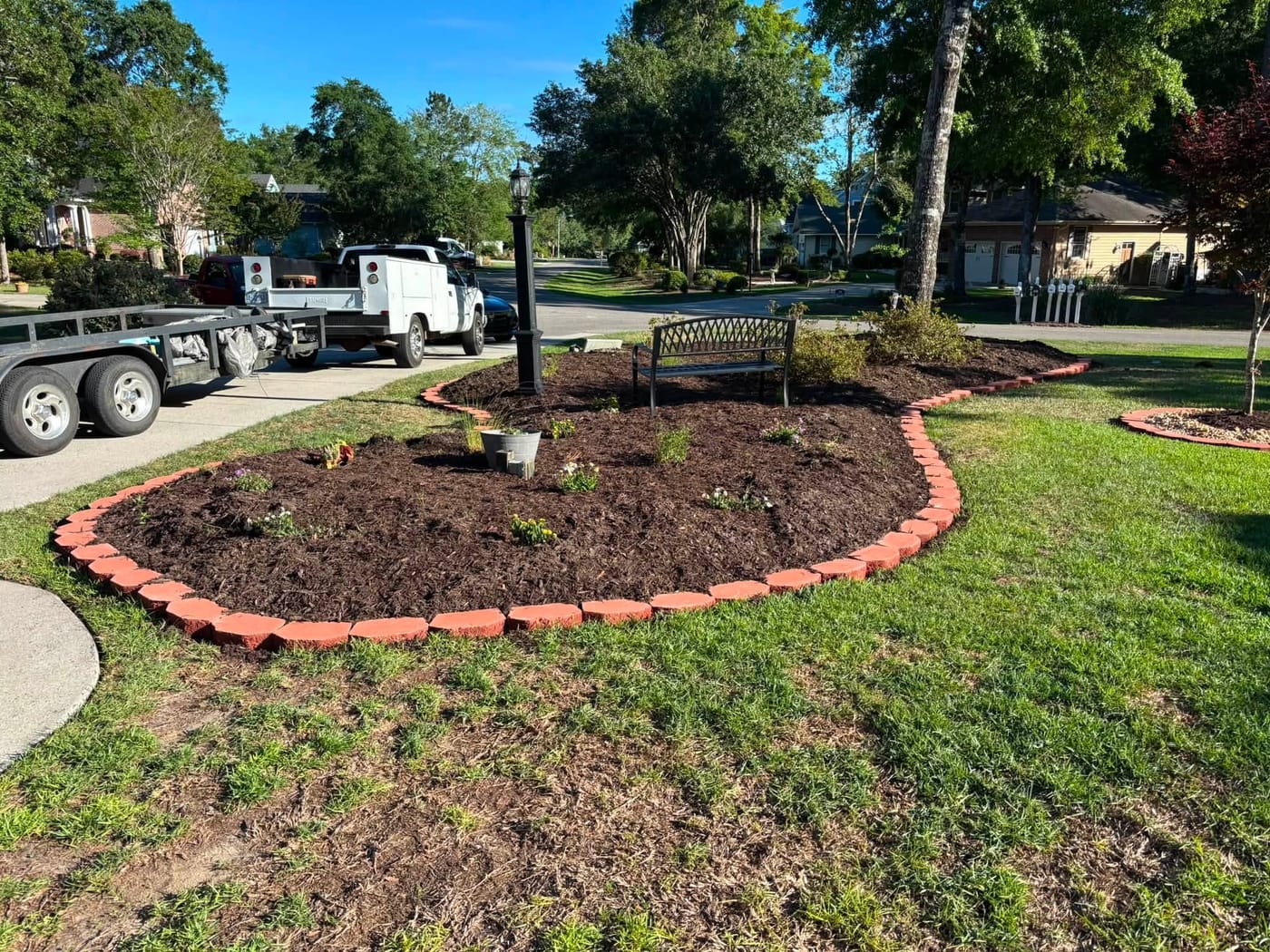 Fresh mulch and landscaped beds by On Edge Lawn Care