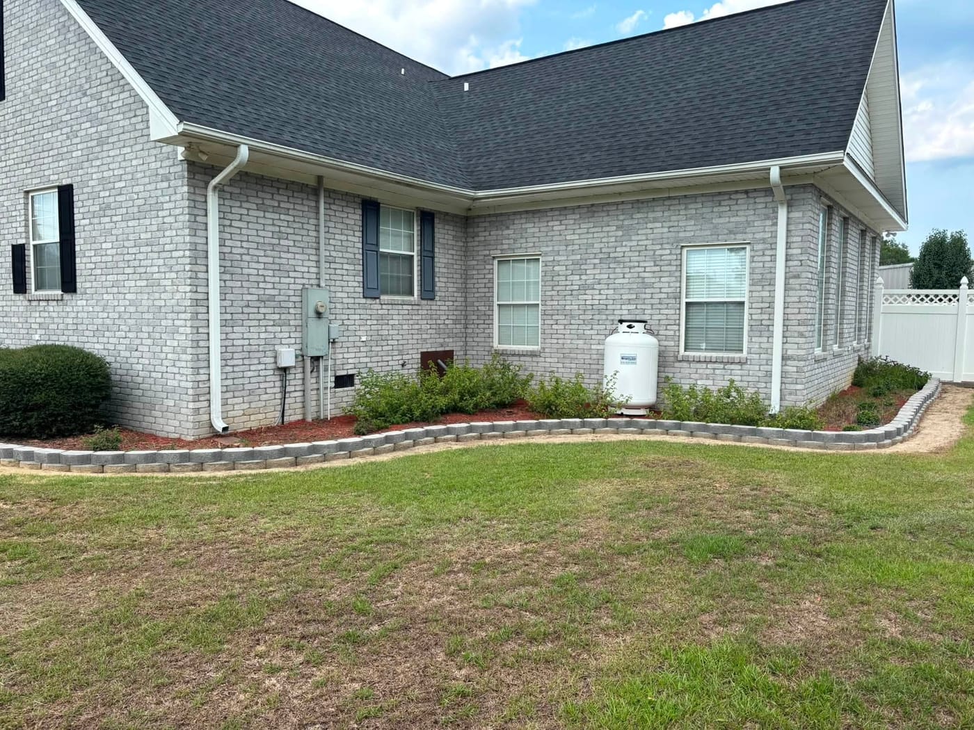 Manicured lawn and trimmed shrubs at a Brunswick County home