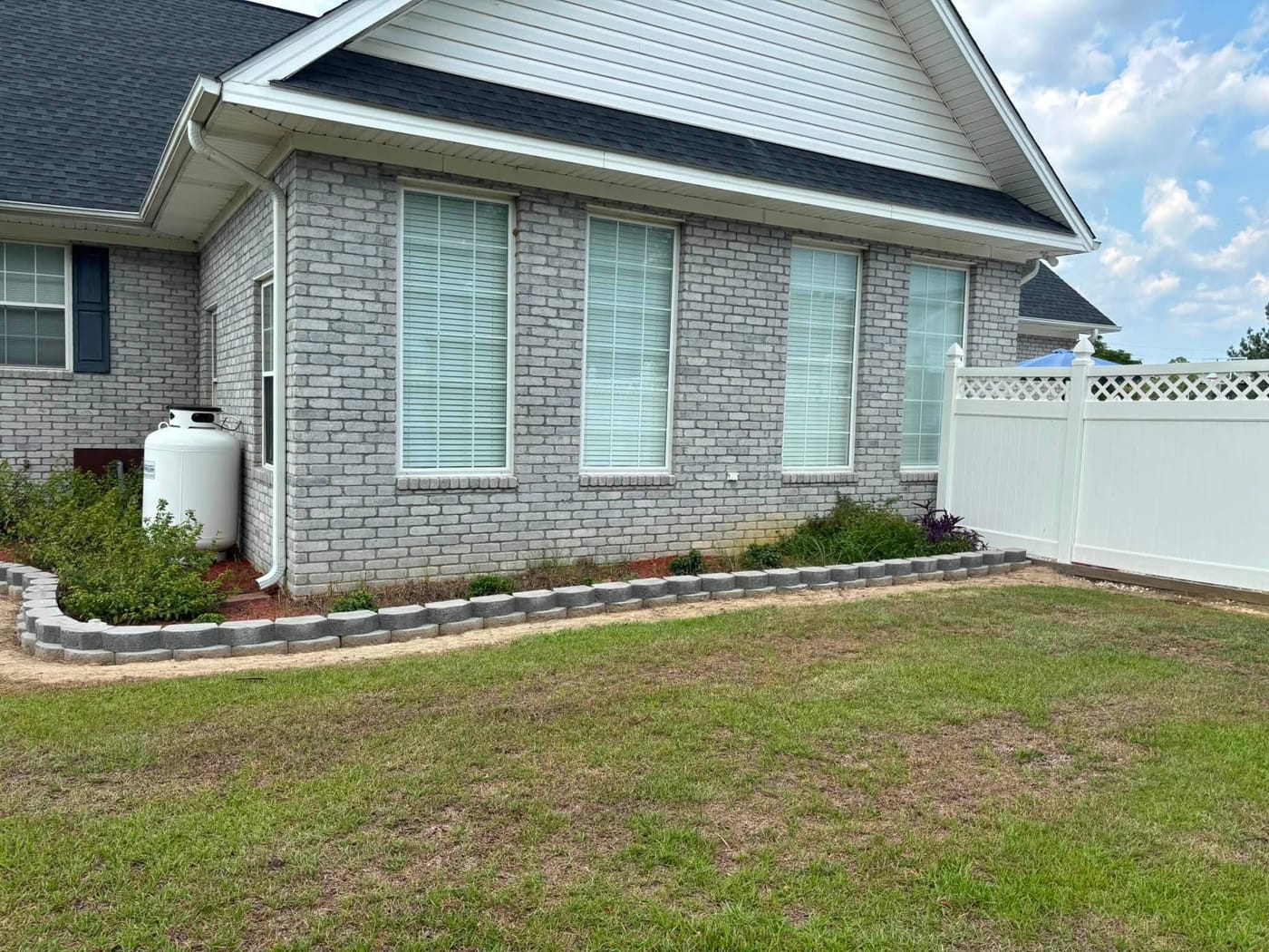 Landscaped front yard with fresh mulch and green grass